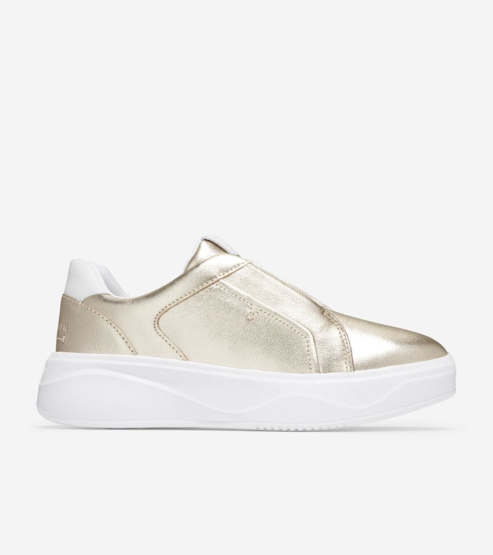 Cole Haan Women's GrandPro Demi Slip On Sneaker - Gold Talca-Optic White